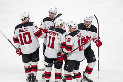 Feb 27, 2024; San Jose, California, USA;  New Jersey Devils right wing Alexander Holtz (10) and center Chris Tierney (11) and left wing Ondrej Palat (18) and defenseman Brendan Smith (2) and defenseman Simon Nemec (17) celebrate after the goal against the San Jose Sharks during the third period at SAP Center at San Jose. Mandatory Credit: Neville E. Guard-USA TODAY Sports