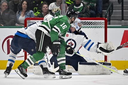 Feb 29, 2024; Dallas, Texas, USA; Dallas Stars center Joe Pavelski (16) scores a goal past Winnipeg Jets goaltender Connor Hellebuyck (37) during the first period at the American Airlines Center. Mandatory Credit: Jerome Miron-USA TODAY Sports