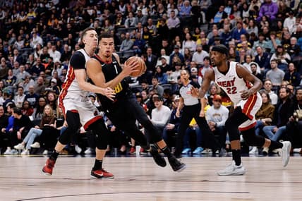 Feb 29, 2024; Denver, Colorado, USA; Denver Nuggets forward Michael Porter Jr. (1) drives to the basket against Miami Heat forward Duncan Robinson (55) in the first quarter at Ball Arena. Mandatory Credit: Isaiah J. Downing-USA TODAY Sports