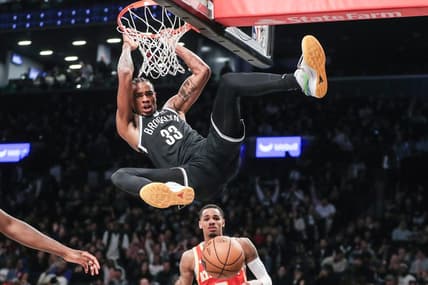 Mar 2, 2024; Brooklyn, New York, USA;  Brooklyn Nets center Nic Claxton (33) dunks in the fourth quarter against the Atlanta Hawks at Barclays Center. Mandatory Credit: Wendell Cruz-USA TODAY Sports