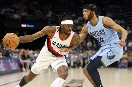 Mar 2, 2024; Memphis, Tennessee, USA; Portland Trail Blazers forward Jerami Grant (9) drives to the basket as Memphis Grizzlies forward Lamar Stevens (24) defends during the first half at FedExForum. Mandatory Credit: Petre Thomas-USA TODAY Sports