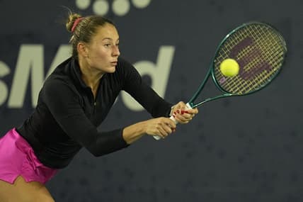 Mar 2, 2024; San Diego, CA, USA; Marta Kostyuk of Ukraine hits a backhand against Jessica Pegula of the United States (not pictured) during the second set of the semifinals of the San Diego Open at Barnes Tennis Center. Mandatory Credit: Ray Acevedo-USA TODAY Sports