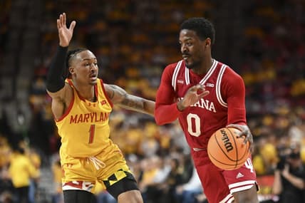 Mar 3, 2024; College Park, Maryland, USA;  Indiana Hoosiers guard Xavier Johnson (0) drives to the basket on Maryland Terrapins guard Jahmir Young (1) during the first half at Xfinity Center. Mandatory Credit: Tommy Gilligan-USA TODAY Sports