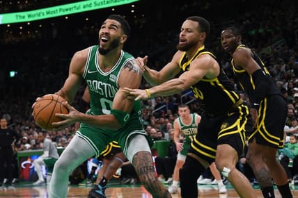 Mar 3, 2024; Boston, Massachusetts, USA;  Boston Celtics forward Jayson Tatum (0) controls the ball while Golden State Warriors guard Stephen Curry (30) defends during the first half at TD Garden. Mandatory Credit: Bob DeChiara-USA TODAY Sports