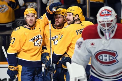 Mar 5, 2024; Nashville, Tennessee, USA; Nashville Predators left wing Filip Forsberg (9) celebrates with teammates after a goal against Montreal Canadiens goaltender Jake Allen (34) during the first period at Bridgestone Arena. Mandatory Credit: Christopher Hanewinckel-USA TODAY Sports