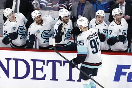 Mar 5, 2024; Winnipeg, Manitoba, CAN; Seattle Kraken left wing Andre Burakovsky (95) celebrates his third period goal against the Winnipeg Jets at Canada Life Centre. Mandatory Credit: James Carey Lauder-USA TODAY Sports
