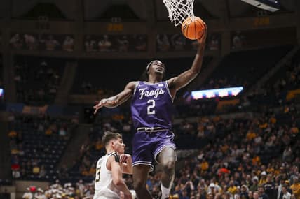 Mar 6, 2024; Morgantown, West Virginia, USA; TCU Horned Frogs forward Emanuel Miller (2) shoots in the lane during the first half against the West Virginia Mountaineers at WVU Coliseum. Mandatory Credit: Ben Queen-USA TODAY Sports
