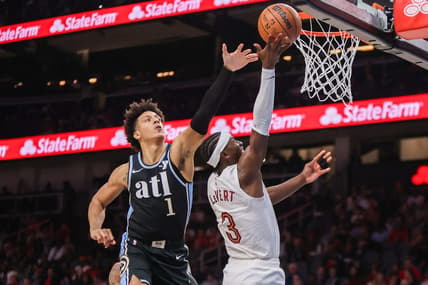 Mar 6, 2024; Atlanta, Georgia, USA; Cleveland Cavaliers guard Caris LeVert (3) shoots past Atlanta Hawks forward Jalen Johnson (1) in the second quarter at State Farm Arena. Mandatory Credit: Brett Davis-USA TODAY Sports