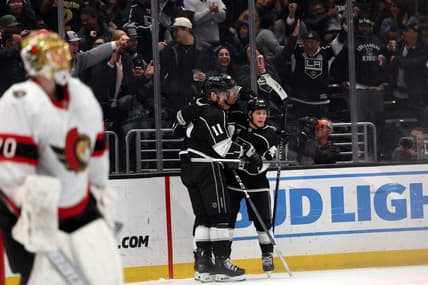 Mar 7, 2024; Los Angeles, California, USA; Los Angeles Kings right wing Quinton Byfield (55, center) celebrates a goal with center Anze Kopitar (11) and center Blake Lizotte (46) during the second period against the Ottawa Senators at Crypto.com Arena. Mandatory Credit: Kiyoshi Mio-USA TODAY Sports