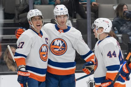Mar 7, 2024; San Jose, California, USA; New York Islanders left wing Anders Lee (27) , left wing Pierre Engvall (18) and center Jean-Gabriel Pageau (44) celebrate during the third period against the San Jose Sharks at SAP Center at San Jose. Mandatory Credit: Stan Szeto-USA TODAY Sports