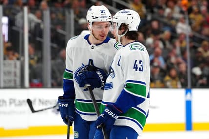 Mar 7, 2024; Las Vegas, Nevada, USA; Vancouver Canucks right wing Vasily Podkolzin (92) talks with Vancouver Canucks defenseman Quinn Hughes (43) before a face off against the Vegas Golden Knights during the first period at T-Mobile Arena. Mandatory Credit: Stephen R. Sylvanie-USA TODAY Sports