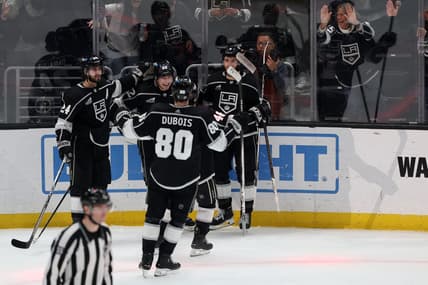Mar 7, 2024; Los Angeles, California, USA;  Los Angeles Kings left wing Kevin Fiala (22, center) celebrates a goal with center Phillip Danault (24) and defenseman Matt Roy (3) and center Pierre-Luc Dubois (80) during the overtime against the Ottawa Senators at Crypto.com Arena. Mandatory Credit: Kiyoshi Mio-USA TODAY Sports