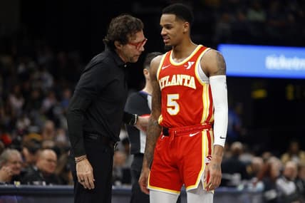 Mar 8, 2024; Memphis, Tennessee, USA; Atlanta Hawks head coach Quin Snyder (left) talks with Atlanta Hawks guard Dejounte Murray (5) during the first half against the Memphis Grizzlies at FedExForum. Mandatory Credit: Petre Thomas-USA TODAY Sports