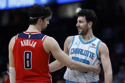 Mar 8, 2024; Washington, District of Columbia, USA; Washington Wizards forward Deni Avdija (8) hugs Charlotte Hornets guard Vasa Micic (22) after their game at Capital One Arena. Mandatory Credit: Geoff Burke-USA TODAY Sports