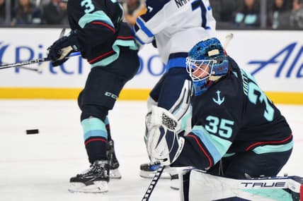 Mar 8, 2024; Seattle, Washington, USA; Seattle Kraken goaltender Joey Daccord (35) blocks a goal shot against the Winnipeg Jets during the first period at Climate Pledge Arena. Mandatory Credit: Steven Bisig-USA TODAY Sports