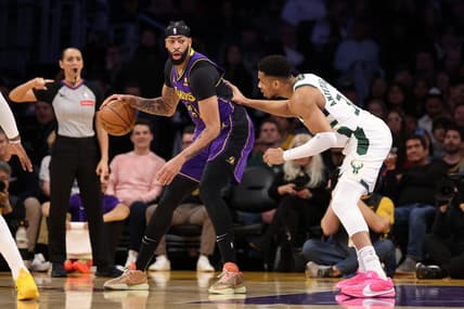 Mar 8, 2024; Los Angeles, California, USA;  Los Angeles Lakers forward Anthony Davis (3) posts up against Milwaukee Bucks forward Giannis Antetokounmpo (34) during the first quarter at Crypto.com Arena. Mandatory Credit: Kiyoshi Mio-USA TODAY Sports