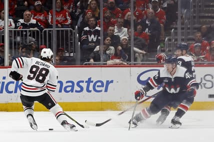 Mar 9, 2024; Washington, District of Columbia, USA; Chicago Blackhawks center Connor Bedard (98) skates with the puck as Washington Capitals left wing Beck Malenstyn (47) and Capitals defenseman Nick Jensen (3) defend in the third period at Capital One Arena. Mandatory Credit: Geoff Burke-USA TODAY Sports