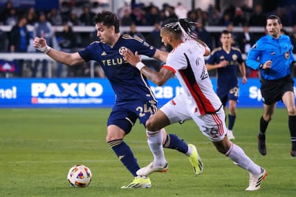 Mar 9, 2024; San Jose, California, USA; Vancouver Whitecaps FC forward Brian White (24) and San Jose Earthquakes defender Rodrigues (26) battle for the ball during the first half at PayPal Park. Mandatory Credit: Kelley L Cox-USA TODAY Sports