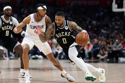 Mar 10, 2024; Los Angeles, California, USA;  Milwaukee Bucks guard Damian Lillard (0) drives to the basket against Los Angeles Clippers guard Brandon Boston Jr. (4) during the third quarter at Crypto.com Arena. Mandatory Credit: Kiyoshi Mio-USA TODAY Sports