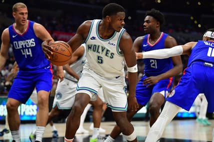 Mar 12, 2024; Los Angeles, California, USA; Minnesota Timberwolves guard Anthony Edwards (5) controls the ball against the Los Angeles Clippers during the second half at Crypto.com Arena. Mandatory Credit: Gary A. Vasquez-USA TODAY Sports