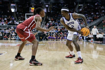 Mar 13, 2024; Kansas City, MO, USA; Oklahoma Sooners guard Otega Oweh (3) guards TCU Horned Frogs forward Emanuel Miller (2) during the first half at T-Mobile Center. Mandatory Credit: William Purnell-USA TODAY Sports