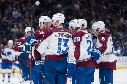 Mar 13, 2024; Vancouver, British Columbia, CAN; Colorado Avalanche forward Mikko Rantanen (96) and forward Valeri Nichushkin (13) and forward Nathan MacKinnon (29) and defenseman Cale Makar (8) celebrate MacKinnon   s game winning overtime goal against the Vancouver Canucks Rogers Arena. Colorado won 4 -3 in overtime. Mandatory Credit: Bob Frid-USA TODAY Sports