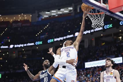 Mar 14, 2024; Oklahoma City, Oklahoma, USA; Oklahoma City Thunder guard Shai Gilgeous-Alexander (2) lays up a shot in front of Dallas Mavericks forward Tim Hardaway Jr. (10) during the second half at Paycom Center. Mandatory Credit: Alonzo Adams-USA TODAY Sports