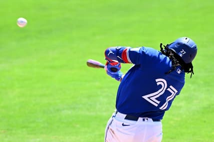 Mar 15, 2024; Dunedin, Florida, USA; Toronto Blue Jays first baseman Vladimir Guerrero Jr. (27) hits a line drive in the third inning of a spring training game against the Detroit Tigers at TD Ballpark. Mandatory Credit: Jonathan Dyer-USA TODAY Sports