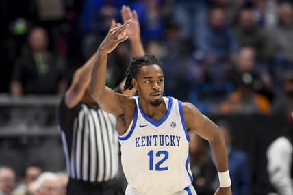 Mar 15, 2024; Nashville, TN, USA; Kentucky Wildcats guard Antonio Reeves (12) celebrates his three point basket against the Texas A&M Aggies during the first half at Bridgestone Arena. Mandatory Credit: Steve Roberts-USA TODAY Sports