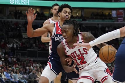 Mar 16, 2024; Chicago, Illinois, USA; Washington Wizards guard Jordan Poole (13) defends Chicago Bulls guard Ayo Dosunmu (12) during the first quarter at United Center. Mandatory Credit: David Banks-USA TODAY Sports