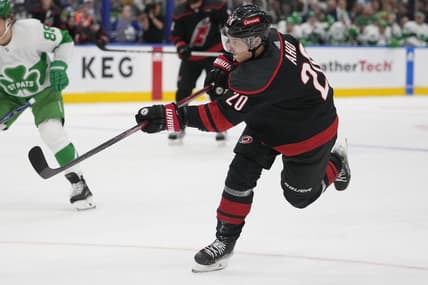 Mar 16, 2024; Toronto, Ontario, CAN; Carolina Hurricanes forward Sebastian Aho (20) shoots the puck against the Toronto Maple Leafs during the second period at Scotiabank Arena. Mandatory Credit: John E. Sokolowski-USA TODAY Sports