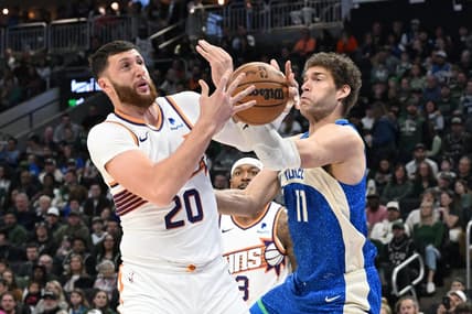 Mar 17, 2024; Milwaukee, Wisconsin, USA; Phoenix Suns center Jusuf Nurkic (20) and Milwaukee Bucks center Brook Lopez (11) battle for possession of the ball in the first half at Fiserv Forum. Mandatory Credit: Michael McLoone-USA TODAY Sports