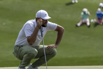 Mar 17, 2024; Ponte Vedra Beach, Florida, USA; Scottie Scheffler lines up a putt on the 3rd green during the final round of THE PLAYERS Championship golf tournament. Mandatory Credit: David Yeazell-USA TODAY Sports