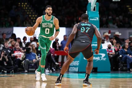 Mar 17, 2024; Washington, District of Columbia, USA; Boston Celtics forward Jayson Tatum (0) brings the ball up court against Washington Wizards forward Eugene Omoruyi (97) during the first half of the game at Capital One Arena. Mandatory Credit: Scott Taetsch-USA TODAY Sports
