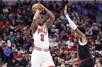 Mar 18, 2024; Chicago, Illinois, USA; Chicago Bulls forward DeMar DeRozan (11) shoots against Portland Trail Blazers guard Anfernee Simons (1) during the first half at United Center. Mandatory Credit: Kamil Krzaczynski-USA TODAY Sports