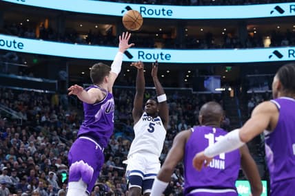 Mar 18, 2024; Salt Lake City, Utah, USA; Minnesota Timberwolves guard Anthony Edwards (5) shoots over Utah Jazz center Walker Kessler (24) during the fourth quarter at Delta Center. Mandatory Credit: Rob Gray-USA TODAY Sports