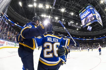 Mar 19, 2024; St. Louis, Missouri, USA;  St. Louis Blues right wing Alexey Toropchenko (13) celebrates with left wing Nathan Walker (26) after scoring against the Colorado Avalanche during the second period at Enterprise Center. Mandatory Credit: Jeff Curry-USA TODAY Sports