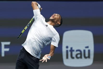 Mar 21, 2024; Miami Gardens, FL, USA; Felix Auger-Aliassime (CAN) serves against Adam Walton (AUS)(not pictured) on day four of the Miami Open at Hard Rock Stadium. Mandatory Credit: Geoff Burke-USA TODAY Sports