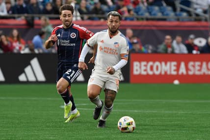 Mar 17, 2024; Foxborough, Massachusetts, USA;  FC Cincinnati midfielder Luciano Acosta (10) controls the ball while New England Revolution midfielder Nacho Gil (21) defends during the second half at Gillette Stadium. Mandatory Credit: Bob DeChiara-USA TODAY Sports