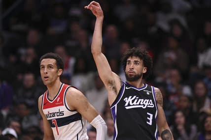 Mar 21, 2024; Washington, District of Columbia, USA;  Sacramento Kings guard Chris Duarte (3) follows through on a three point basket as Washington Wizards forward Patrick Baldwin Jr. (7) looks on during the first half at Capital One Arena. Mandatory Credit: Tommy Gilligan-USA TODAY Sports