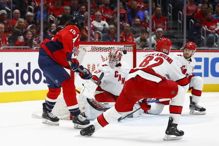 Mar 22, 2024; Washington, District of Columbia, USA; Washington Capitals left wing Sonny Milano (15) scores a goal past Carolina Hurricanes goaltender Pyotr Kochetkov (52) during the first period at Capital One Arena. Mandatory Credit: Amber Searls-USA TODAY Sports
