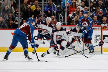 Mar 22, 2024; Denver, Colorado, USA; Colorado Avalanche defenseman Cale Makar (8) controls the puck as Columbus Blue Jackets right wing Mathieu Olivier (24) and defenseman Jake Bean (22) and goaltender Elvis Merzlikins (90) and right wing Valeri Nichushkin (13) look on in the first period at Ball Arena. Mandatory Credit: Isaiah J. Downing-USA TODAY Sports