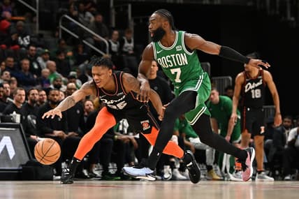 Mar 22, 2024; Detroit, Michigan, USA; Detroit Pistons guard Marcus Sasser (25) loses control of his dribble while being defended by Boston Celtics guard Jaylen Brown (7) in the third quarter at Little Caesars Arena. Mandatory Credit: Lon Horwedel-USA TODAY Sports