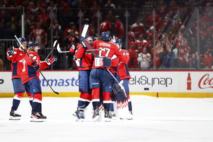 Mar 22, 2024; Washington, District of Columbia, USA; Washington Capitals players celebrate after defeating the Carolina Hurricanes during a shootout at Capital One Arena. Mandatory Credit: Amber Searls-USA TODAY Sports