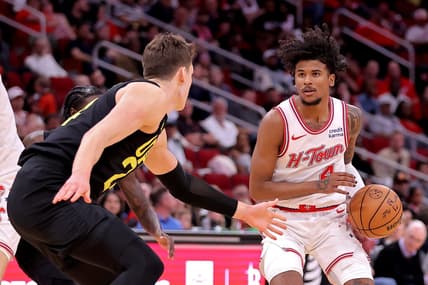 Mar 23, 2024; Houston, Texas, USA; Houston Rockets guard Jalen Green (4) handles the ball against Utah Jazz center Walker Kessler (24) during the third quarter at Toyota Center. Mandatory Credit: Erik Williams-USA TODAY Sports
