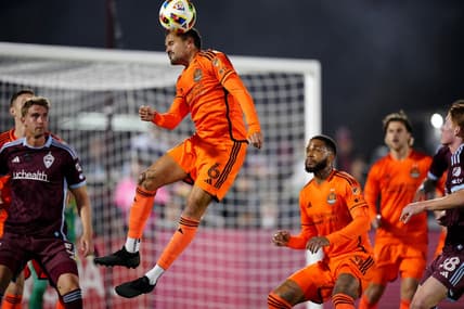 Mar 23, 2024; Commerce City, Colorado, USA; Houston Dynamo FC midfielder Artur (6) heads the ball in front of the Colorado Rapids goal during the first half at Dick's Sporting Goods Park. Mandatory Credit: Ron Chenoy-USA TODAY Sports