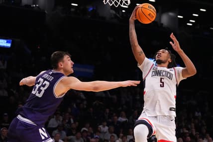 Mar 24, 2024; Brooklyn, NY, USA; Connecticut Huskies guard Stephon Castle (5) shoots the ball over Northwestern Wildcats forward Luke Hunger (33) in the second round of the 2024 NCAA Tournament at the Barclays Center. Mandatory Credit: Robert Deutsch-USA TODAY Sports
