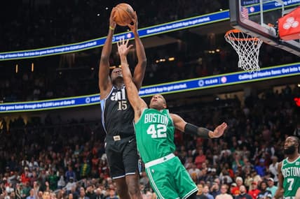 Mar 25, 2024; Atlanta, Georgia, USA; Atlanta Hawks center Clint Capela (15) grabs a rebound over Boston Celtics center Al Horford (42) in the second half at State Farm Arena. Mandatory Credit: Brett Davis-USA TODAY Sports