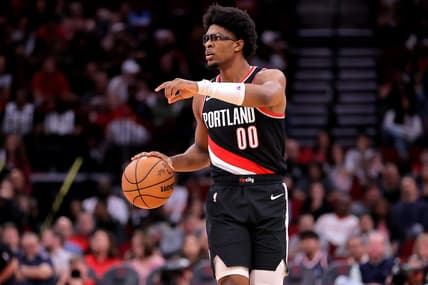 Mar 25, 2024; Houston, Texas, USA; Portland Trail Blazers guard Scoot Henderson (00) handles the ball against the Houston Rockets during the fourth quarter at Toyota Center. Mandatory Credit: Erik Williams-USA TODAY Sports