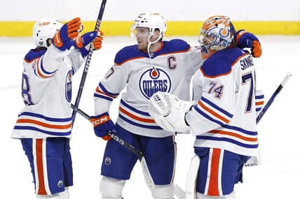 Mar 26, 2024; Winnipeg, Manitoba, CAN; Edmonton Oilers right wing Connor Brown (28), Edmonton Oilers center Connor McDavid (97) and Edmonton Oilers goaltender Stuart Skinner (74) celebrate their overtime victory against the Winnipeg Jets at Canada Life Centre. Mandatory Credit: James Carey Lauder-USA TODAY Sports